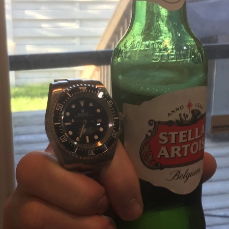 Rolex and beer.....ahhh good.