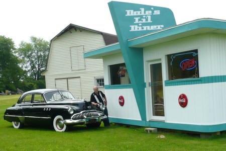 Me, my old car and my mini barn (looks like a diner)