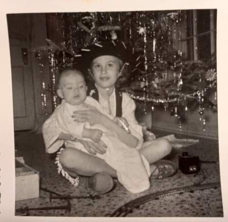My sister Susan holding me 1956