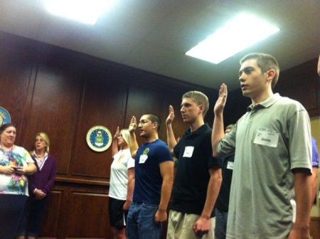 Nicholas taking his USMC oath, black shirt