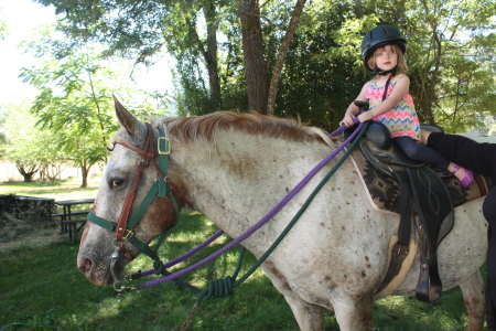 Grand daughter , Chloe on Moms horse.