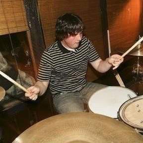 Paul practicing on his drums