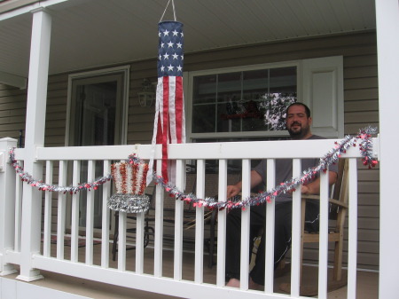 Jason sitting on porch b/4 leaving for CA