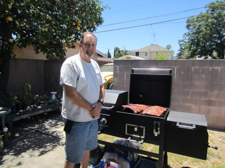 Mike with his new gril, smoker, seering station