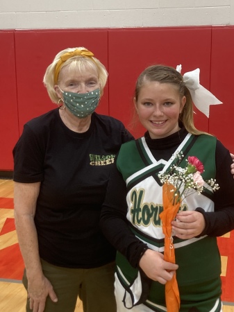 Me and my granddaughter at cheer competition