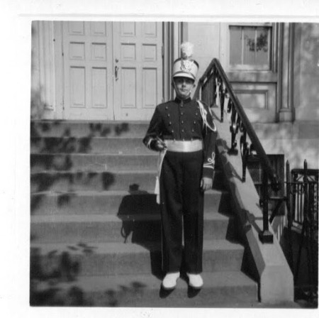 Gregory Han on school steps in Ramblers unifor