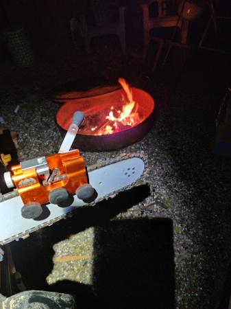 Sharpening chain by the firepit.  37 deg. F.