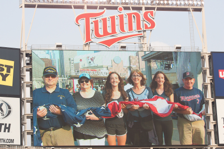 Frank Cleveland's album, US flag raising at the Minnesota Twins game