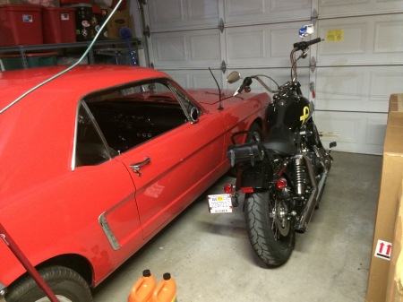Mustang and Harley in the garage