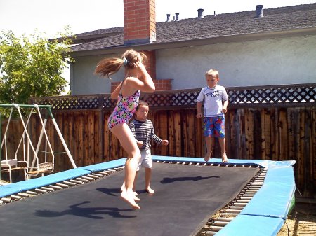 3 of my 10 grandkids playing in my back yard