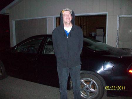 My Son Dustin with his new car.