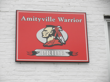 Sign on Amityville High School showing school Pride