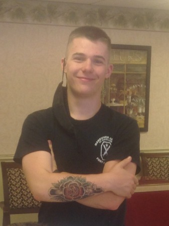 My son Ryan showing off his first tattoo.