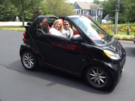 Paul and Sherry in their Smart car Maine