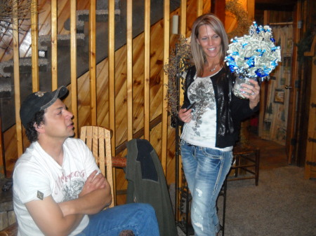 My oldest Daughter, Kristie showing off the money bouquet to her husband.(my son-in-law, Teddy)