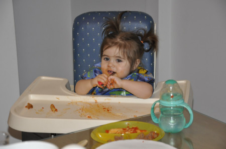 Granddaughter eating spaghetti