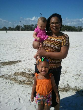 Linda is holding Alayiah and JaNiah is standin