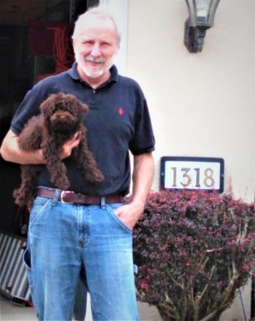 Husband Roy with our Cody the schnoodle 2016