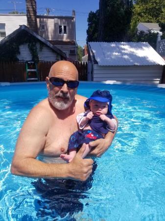 Grandpa swimming with Nicholas 