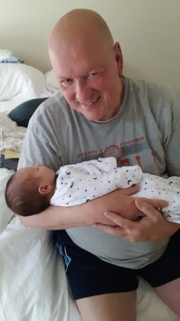 Grandpa holding Jacob for first time 4-27-20