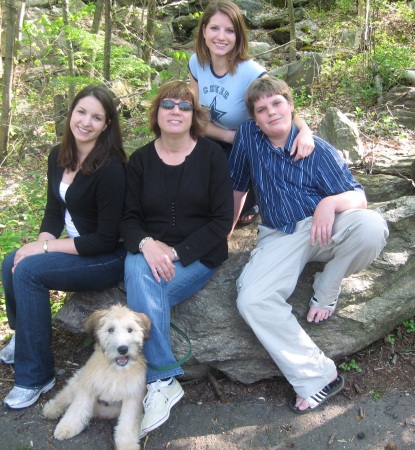 Wife and kids with Ozzie the pup