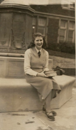 Gladys Warder sitting by Eastern flagpole
