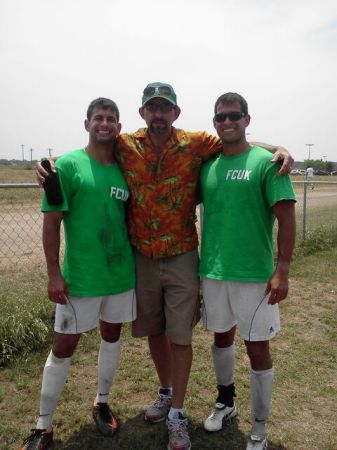 Proud dad of sons playing soccer