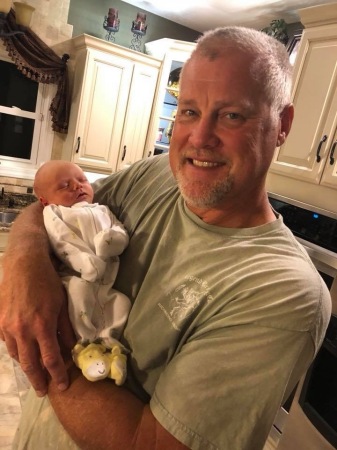 My oldest son Rob holding  his grandson!