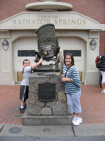 Logan and Dad at Flo's V8 Cafe in CarsLand