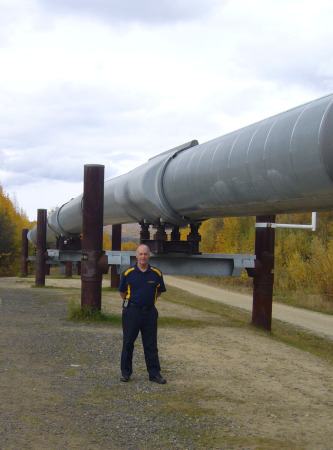 Standing next to the Alaskan Pipeline in Fairbanks AK