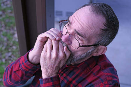 Playing the harmonica