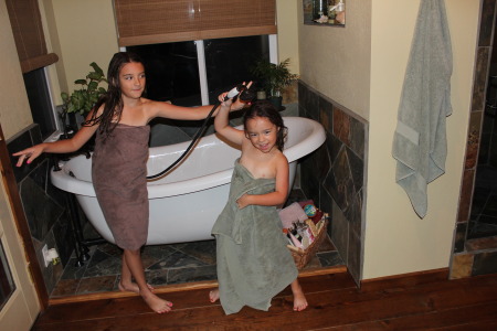 My granddaughters making their bath time fun!