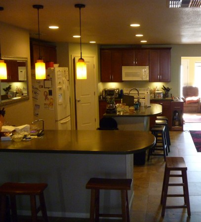 House interior from living room through kitchen and in to sun room