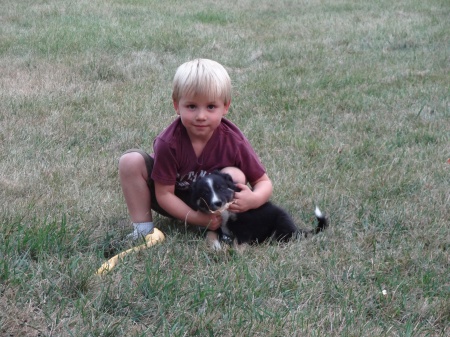 4 year old grandson Grant and 6 week old cow!