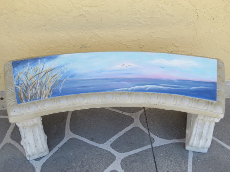 Ocean view painting on cement bench 