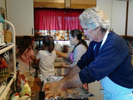 Our 2 youngest granddaughters cooking with Grammie and Papa