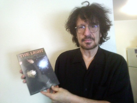 Me holding my Graphic Novel "The Light"