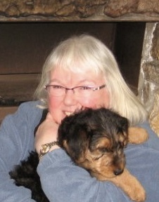 Anne cuddling with Buddy as a puppy