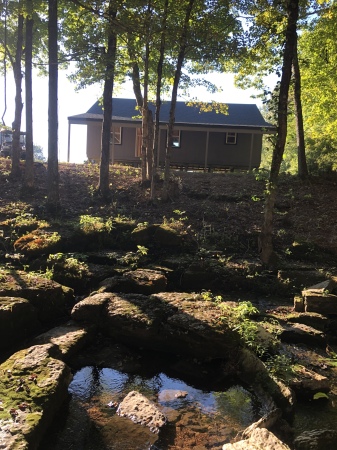 Cabin in front of creek in tn