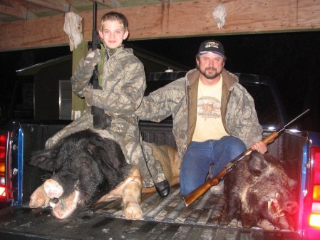 Hog hunting with my youngest son. 2004