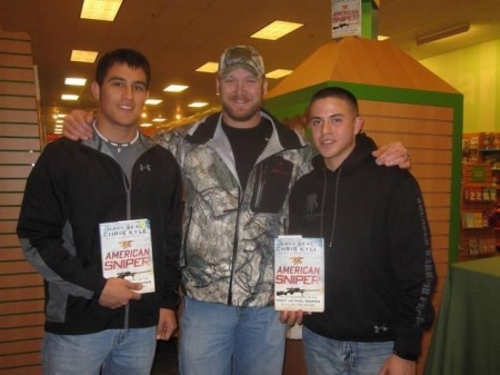 My son (shorter one) with the late Chris Kyle.