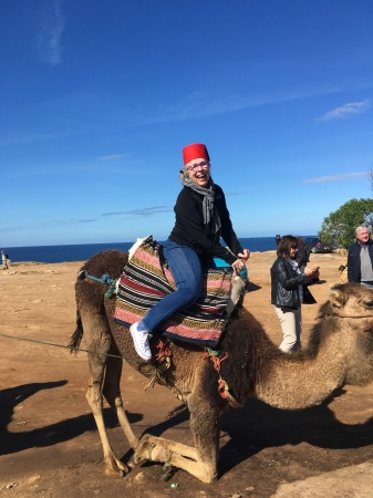 Wife Cindy on a camel in Tangier, Morocco