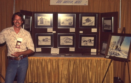 Dick with display of railroad depot drawings
