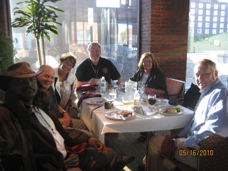 Jim Pritchert dining with friends