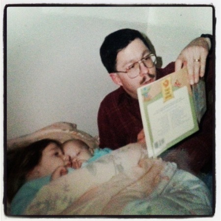 Reading a bedtime story to my daughters, 1989.