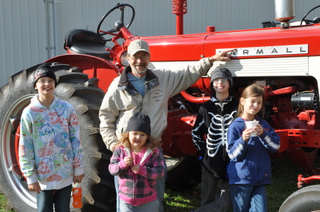 Papa shows the grandkids a MCCORMICK tractor!!