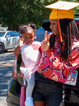 My oldest daughter graduation hold my granddau