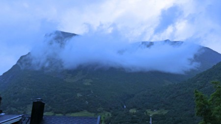 Mountain partially obscured by cloud