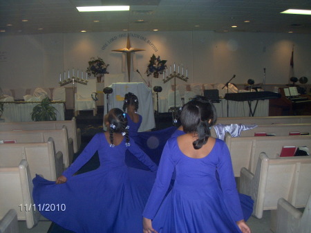 Dancers prepare for photo shoot.