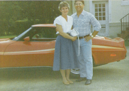 Young couple with fun car